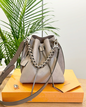 Load image into Gallery viewer, LOUIS VUITTON 2024 Muria Mahina Leather Bucket Bag in Galet Gray