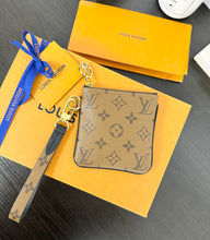 Load image into Gallery viewer, LOUIS VUITTON 2023 Monogram Reverse Square Wristlet Pouch
