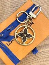 Load image into Gallery viewer, LOUIS VUITTON 2022 Puzzle Flower Monogram Keyring
